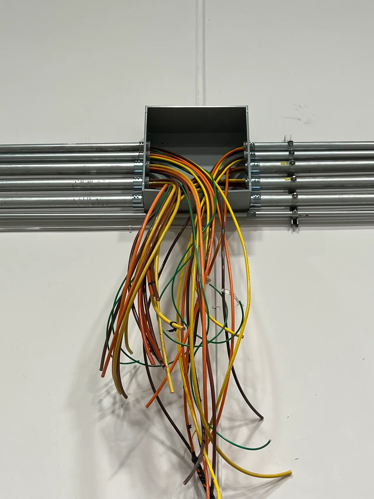 Electrical wiring and conduit at a junction box